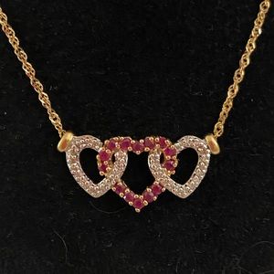 Ruby and diamond 14 karat gold heart necklace